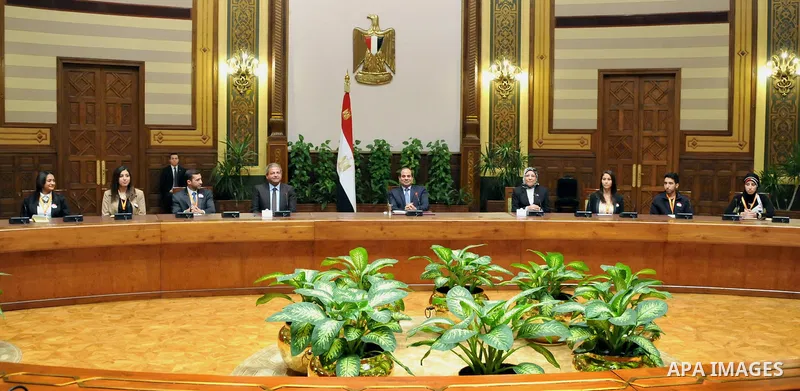 A handout picture released by the Egyptian Presidency shows Egypt's President Abdel Fattah al-Sisi meeting with expatriate students in Cairo, Egypt, Dec. 30, 2014. Photo by Egyptian Presidency