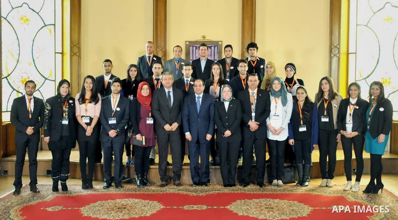 A handout picture released by the Egyptian Presidency shows Egypt's President Abdel Fattah al-Sisi meeting with expatriate students in Cairo, Egypt, Dec. 30, 2014. Photo by Egyptian Presidency