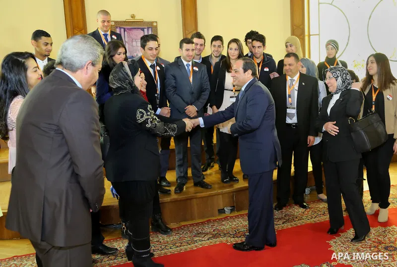 A handout picture released by the Egyptian Presidency shows Egypt's President Abdel Fattah al-Sisi meeting with expatriate students in Cairo, Egypt, Dec. 30, 2014. Photo by Egyptian Presidency