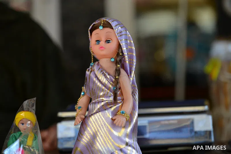A doll toy is displayed at a shop in preparation to celebrate the birthday of prophet Muhammad, also known as "Mawlid Nabawi", which will fall next week, in Cairo, December 31, 2014. Photo by Amr Sayed