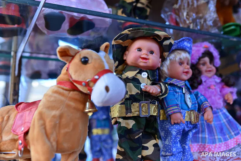 Doll toys are displayed at a shop in preparation to celebrate the birthday of prophet Muhammad, also known as "Mawlid Nabawi", which will fall next week, in Cairo, December 31, 2014. Photo by Amr Sayed