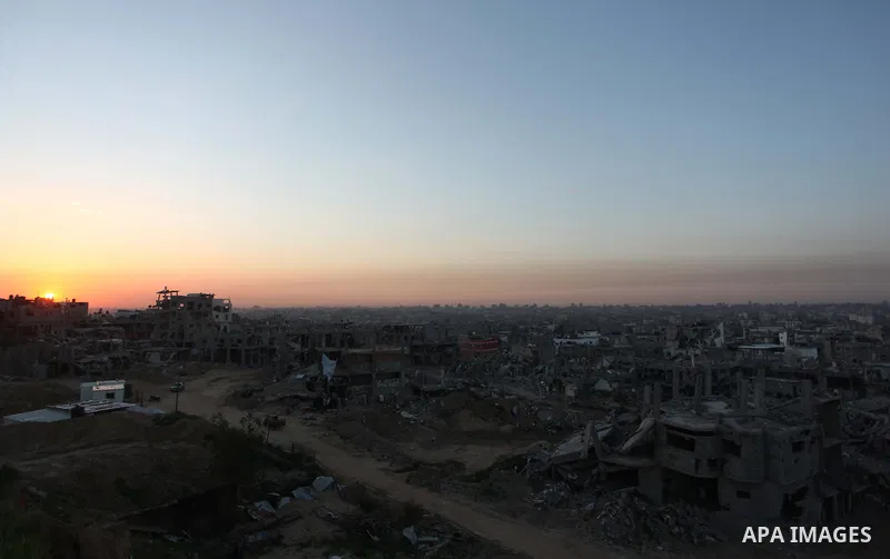 The rubbles of houses, which were destroyed during the recent Israeli offensive on Gaza Strip, are seen in the last sunset of 2014, in Shijaiyah neighborhood, east Gaza city December 31, 2014. Photo by Ashraf Amra