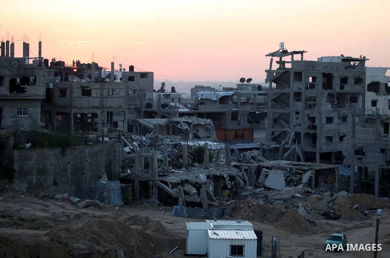 The rubbles of houses, which were destroyed during the recent Israeli offensive on Gaza Strip, are seen in the last day of 2014, in Shijaiyah neighborhood, east Gaza city December 31, 2014. Photo by Ashraf Amra