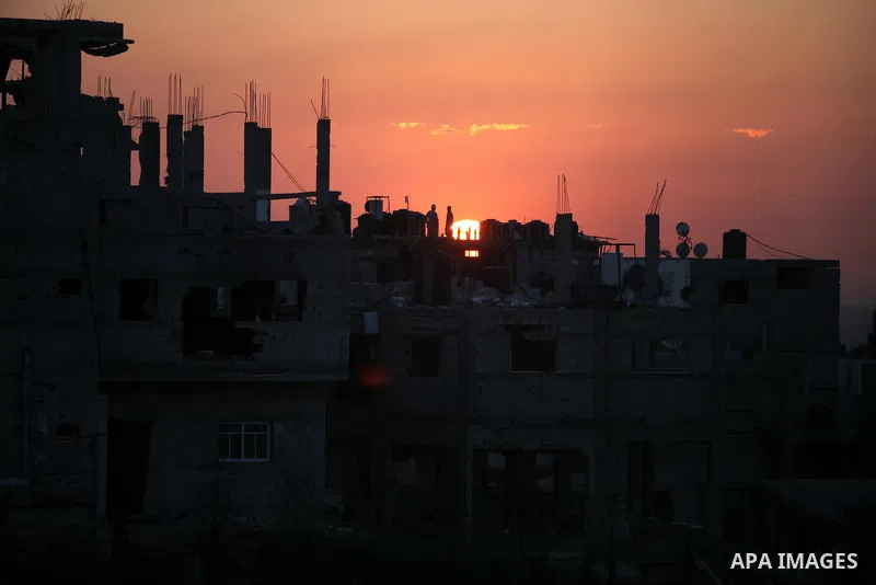 The rubbles of houses, which were destroyed during the recent Israeli offensive on Gaza Strip, are seen in the last sunset of 2014, in Shijaiyah neighborhood, east Gaza city December 31, 2014. Photo by Ashraf Amra