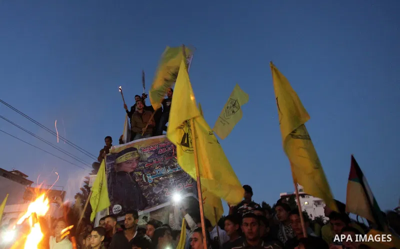 Palestinian Fatah supporter shout slogans during a gathering to celebrate the fiftieth anniversary of the start of the Fatah movement, in Gaza city on December 31, 2014. The Fatah movement was founded by the late iconic...