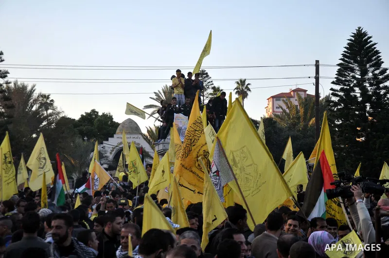 Palestinian Fatah supporter shout slogans during a gathering to celebrate the fiftieth anniversary of the start of the Fatah movement, in Gaza city on December 31, 2014. The Fatah movement was founded by the late iconic...