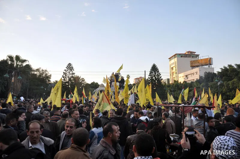 Palestinian Fatah supporter shout slogans during a gathering to celebrate the fiftieth anniversary of the start of the Fatah movement, in Gaza city on December 31, 2014. The Fatah movement was founded by the late iconic...