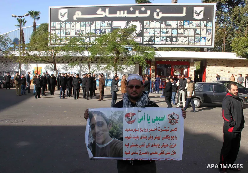 Egyptians families hold banners and pictures for their sons who killed in stadium riot in the canal city of Port Said, during a protest in front of headquarter of Al-ahly club in Cairo, Egypt, on January 06, 2015. Photo...