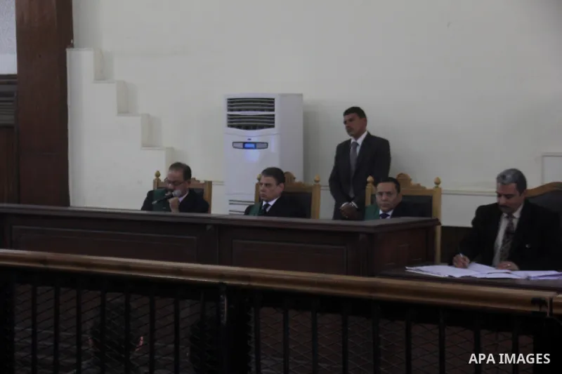 Egyptian Judges attend the trial of Egyptian members of Muslim Brotherhood at the court in Cairo January 10, 2014. Photo by Amr Sayed