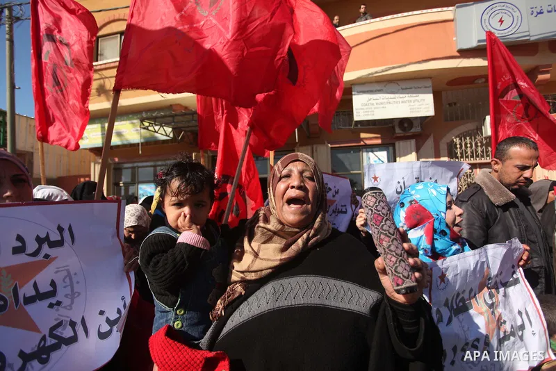 Palestinians take part in a protest against power crisis in Gaza, in al-Zawaideh village in the central Gaza Strip January 13, 2015. The protest was organized by Palestinian leftist parties. Palestinian Energy officials...