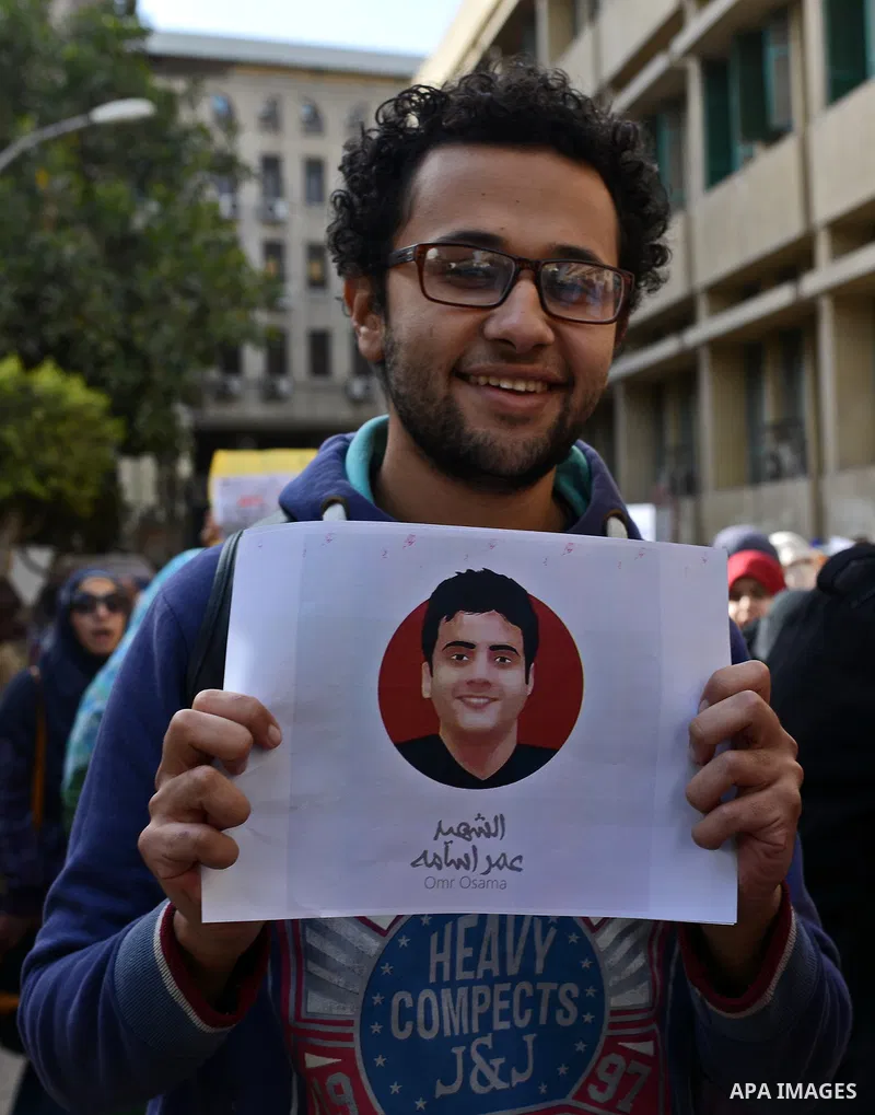 Egyptian students who support ousted President Mohamed Morsi and the Muslim Brotherhood take part in a protest marking the first anniversary of the storming of Cairo University by Egyptian security forces, at the Cairo U...