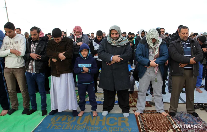 Palestinians perform Friday prayers at the Rafah border crossing between Egypt and southern Gaza Strip January 16, 2015, to demand that Egyptian authorities open the crossing. Egypt shut Rafah crossing, Gaza's main windo...