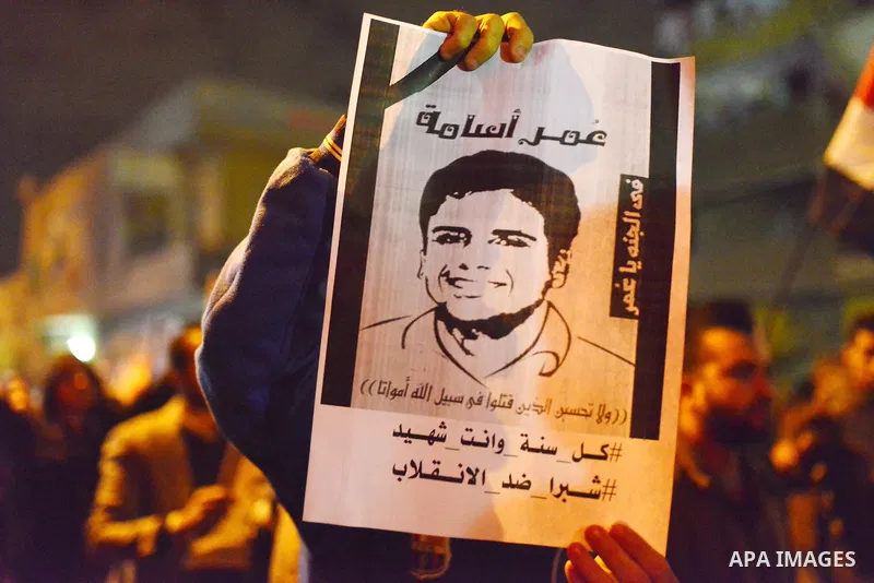 Egyptian students who support ousted President Mohamed Morsi and the Muslim Brotherhood take part in a protest marking the first anniversary of the storming of Cairo University by Egyptian security forces, in El-Sharabia...
