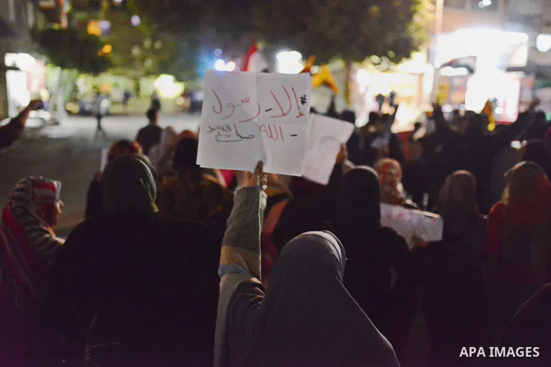 Egyptian students who support ousted President Mohamed Morsi and the Muslim Brotherhood take part in a protest marking the first anniversary of the storming of Cairo University by Egyptian security forces, in El-Sharabia...