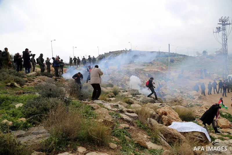 Palestinian protesters clash with Israeli soldiers during a demonstration against the closure of the main road in Jabaa area south of the West Bank city of Bethlehem January 17, 2015. For the past 14-years Israeli milita...