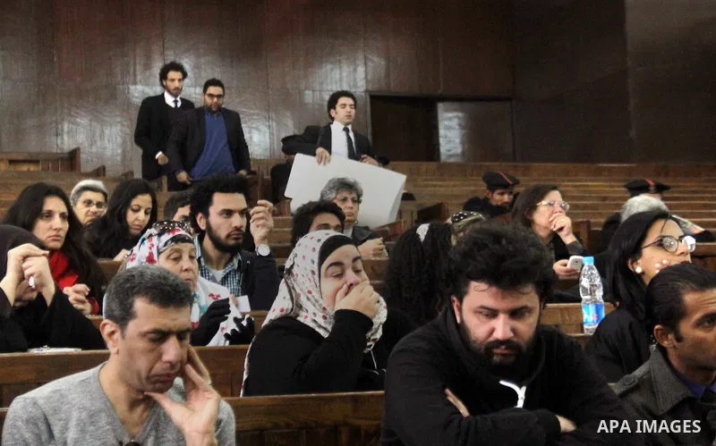 Relatives and friends attend the retrial of Alaa Abdel Fattah and 24 others, in the courtroom in Cairo on January 17, 2015. The defendants were sentenced in June to 15 years in prison for holding an unlicensed and violen...
