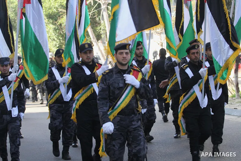 Palestinian members of the National Security forces march during a military parade to mark the anniversary of late the former interior minister, Said Siyam, in Gaza City, January 18, 2015. Photo by Mohammed Asad