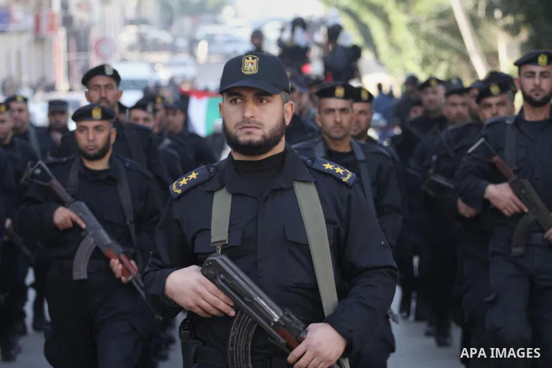 Palestinian members of the National Security forces march during a military parade to mark the anniversary of late the former interior minister, Said Siyam, in Gaza City, January 18, 2015. Photo by Mohammed Asad