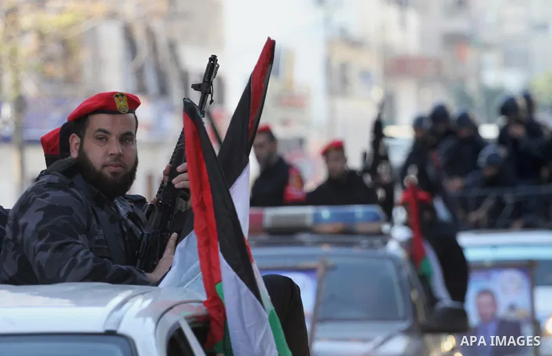 Palestinian members of the National Security forces march during a military parade to mark the anniversary of late the former interior minister, Said Siyam, in Gaza City, January 18, 2015. Photo by Mohammed Asad