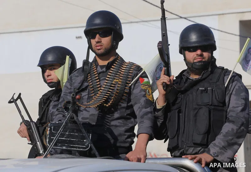 Palestinian members of the National Security forces march during a military parade to mark the anniversary of late the former interior minister, Said Siyam, in Gaza City, January 18, 2015. Photo by Mohammed Asad