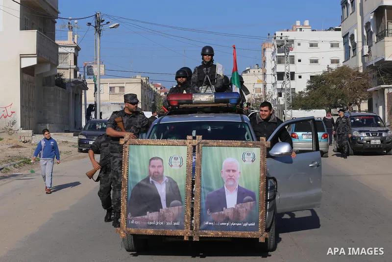 Palestinian members of the National Security forces march during a military parade to mark the anniversary of late the former interior minister, Said Siyam, in Gaza City, January 18, 2015. Photo by Mohammed Asad