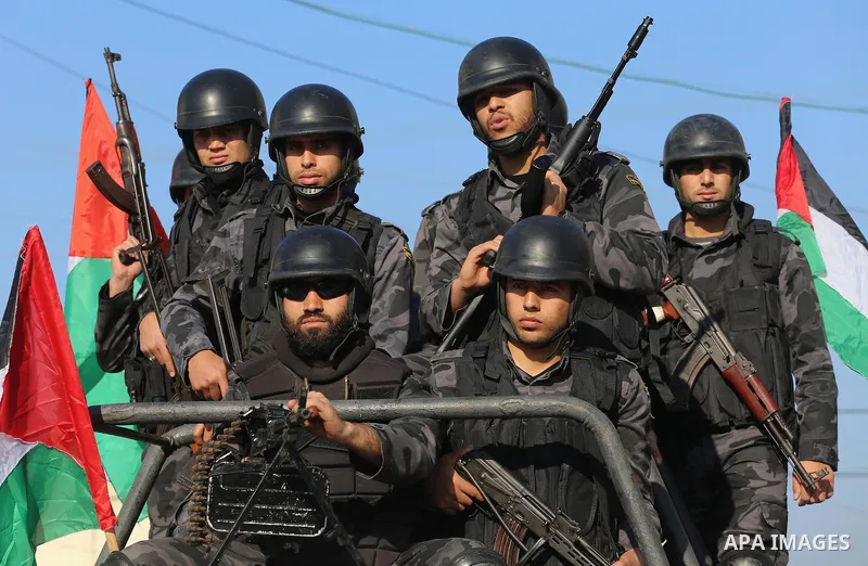 Palestinian members of the National Security forces march during a military parade to mark the anniversary of late the former interior minister, Said Siyam, in Gaza City, January 18, 2015. Photo by Mohammed Asad