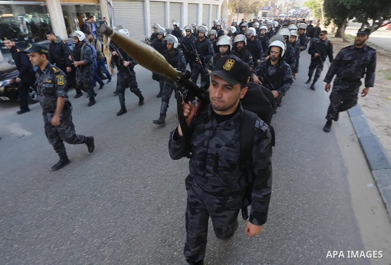 Palestinian members of the National Security forces march during a military parade to mark the anniversary of late the former interior minister, Said Siyam, in Gaza City, January 18, 2015. Photo by Mohammed Asad