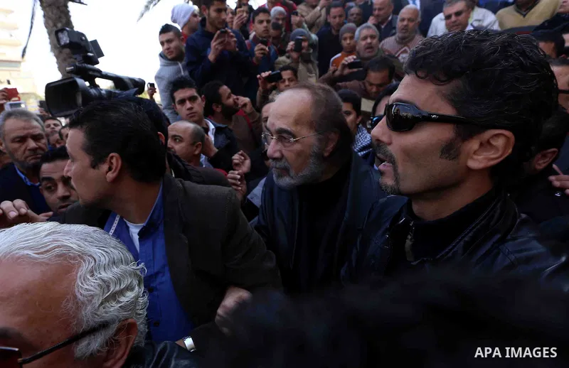 Egyptian actor Mahmoud Yassin (C), attends the funeral of Egyptian actress Faten Hamama in 6th of October City on the outskirts of Cairo on January 18, 2015. Hamama, an Arab film icon and Omar Sharif's former wife, died...