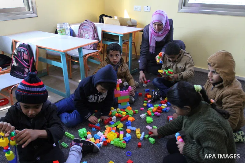 Deaf Palestinian children play in a foundation for rehabilitation deaf children, in Khan Younis in the southern Gaza Strip, January 18, 2015. There are approximately 25,000 deaf and hearing impaired people in the Gaza St...