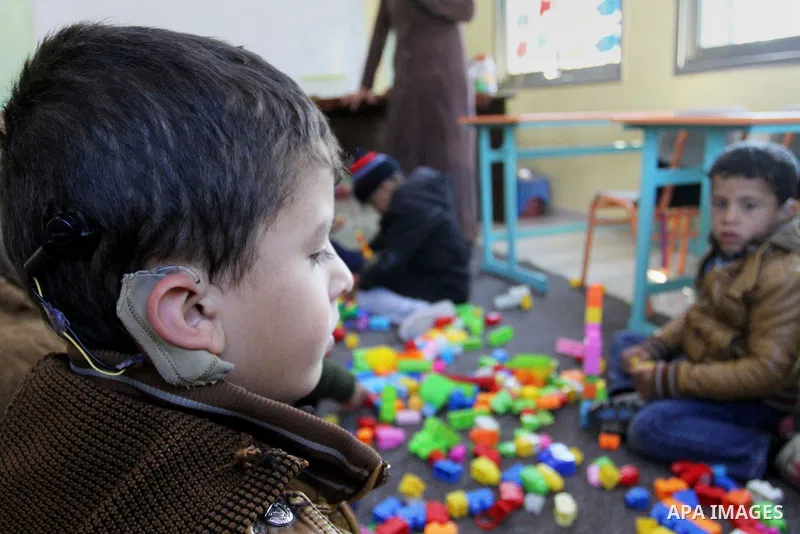 Deaf Palestinian children play in a foundation for rehabilitation deaf children, in Khan Younis in the southern Gaza Strip, January 18, 2015. There are approximately 25,000 deaf and hearing impaired people in the Gaza St...