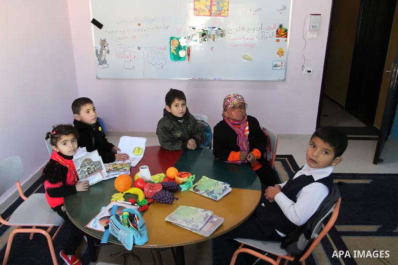 Deaf Palestinian children play in a foundation for rehabilitation deaf children, in Khan Younis in the southern Gaza Strip, January 18, 2015. There are approximately 25,000 deaf and hearing impaired people in the Gaza St...
