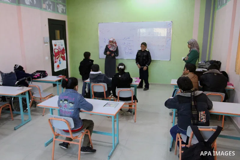 Deaf Palestinian children study in a foundation for rehabilitation deaf children, in Khan Younis in the southern Gaza Strip, January 18, 2015. There are approximately 25,000 deaf and hearing impaired people in the Gaza S...