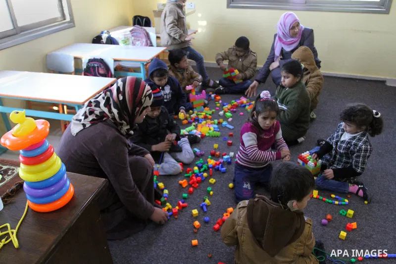Deaf Palestinian children play in a foundation for rehabilitation deaf children, in Khan Younis in the southern Gaza Strip, January 18, 2015. There are approximately 25,000 deaf and hearing impaired people in the Gaza St...