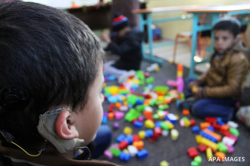 Deaf Palestinian children play in a foundation for rehabilitation deaf children, in Khan Younis in the southern Gaza Strip, January 18, 2015. There are approximately 25,000 deaf and hearing impaired people in the Gaza St...