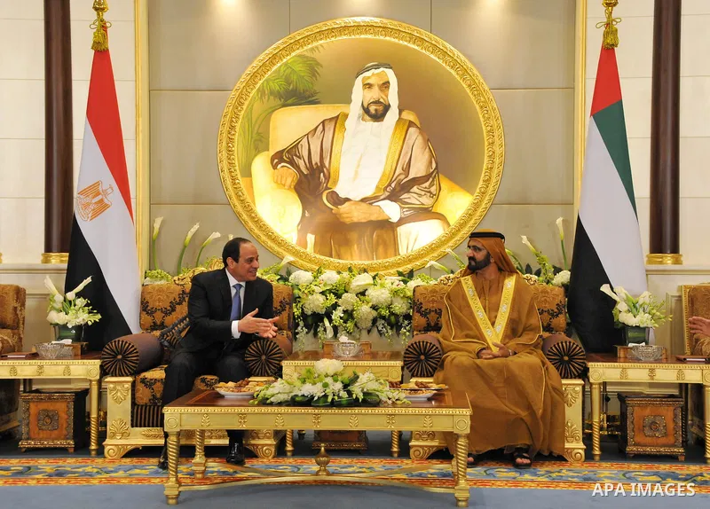 A handout picture released by Egypt's Middle East News Agency (MENA) shows United Arab Emirates's Sheikh Mohammed bin Rashid al-Maktoum (R), meets with Egypt's President Abdel Fattah al-Sisi (L) in Abu Dhabi. APAIMAGES/O...
