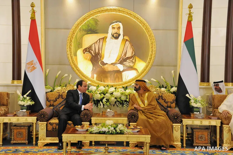 A handout picture released by Egypt's Middle East News Agency (MENA) shows United Arab Emirates's Sheikh Mohammed bin Rashid al-Maktoum (R), meets with Egypt's President Abdel Fattah al-Sisi (L) in Abu Dhabi. APAIMAGES/O...