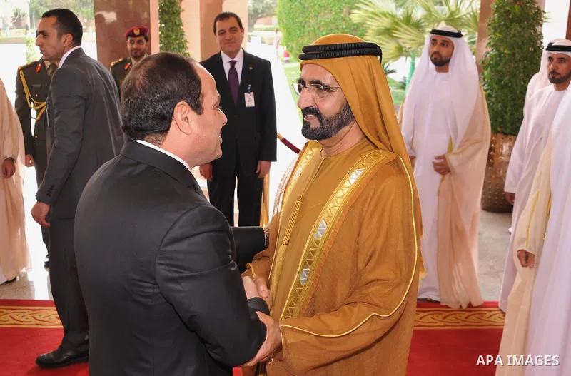 A handout picture released by Egypt's Middle East News Agency (MENA) shows United Arab Emirates's Sheikh Mohammed bin Rashid al-Maktoum (R), meets with Egypt's President Abdel Fattah al-Sisi (L) in Abu Dhabi. APAIMAGES/O...