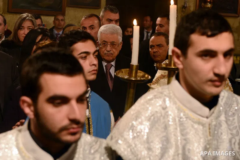 Palestinian President, Mahmoud Abbas (Abu Mazen), attends a celebration Christmas to mark the birth of Jesus on January 18, according to the Julian calendar in the West Bank city of Bethlehem on January 18, 2015. Photo b...