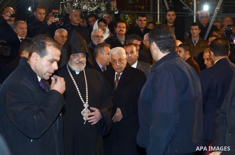 Palestinian President, Mahmoud Abbas (Abu Mazen), attends a celebration Christmas to mark the birth of Jesus on January 18, according to the Julian calendar in the West Bank city of Bethlehem on January 18, 2015. Photo b...