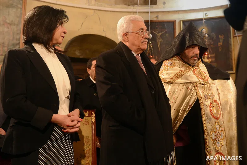 Palestinian President, Mahmoud Abbas (Abu Mazen), attends a celebration Christmas to mark the birth of Jesus on January 18, according to the Julian calendar in the West Bank city of Bethlehem on January 18, 2015. Photo b...