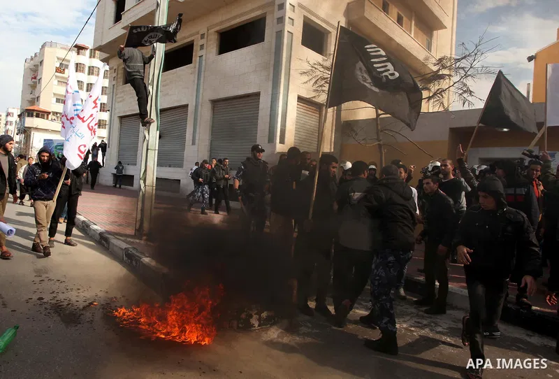 Palestinian Salafists burn French flag during in a protest against satirical French weekly magazine Charlie Hebdo's cartoons of the Prophet Mohammad, outside the French Cultural Centre in Gaza city January 19, 2015. Doze...