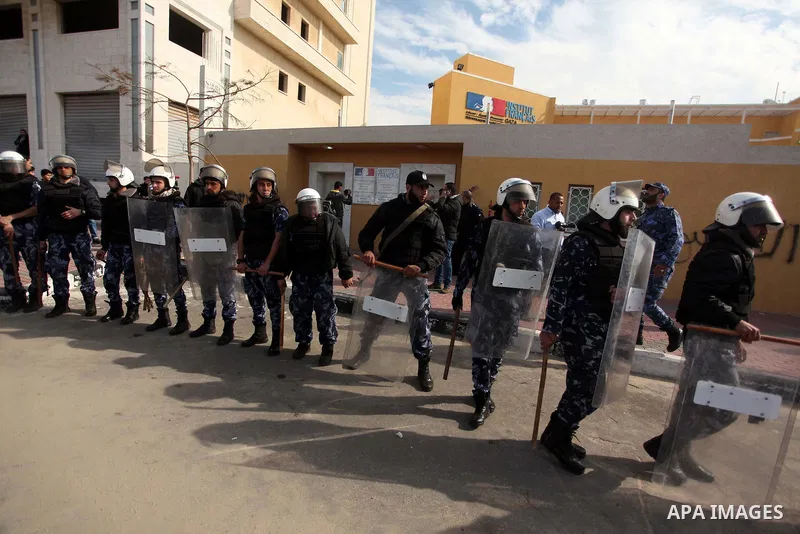 Palestinian policemen loyal to Hamas stand guard during a protest against the satirical French weekly magazine Charlie Hebdo's cartoons of the Prophet Mohammad, outside the French Cultural Centre in Gaza city January 19,...
