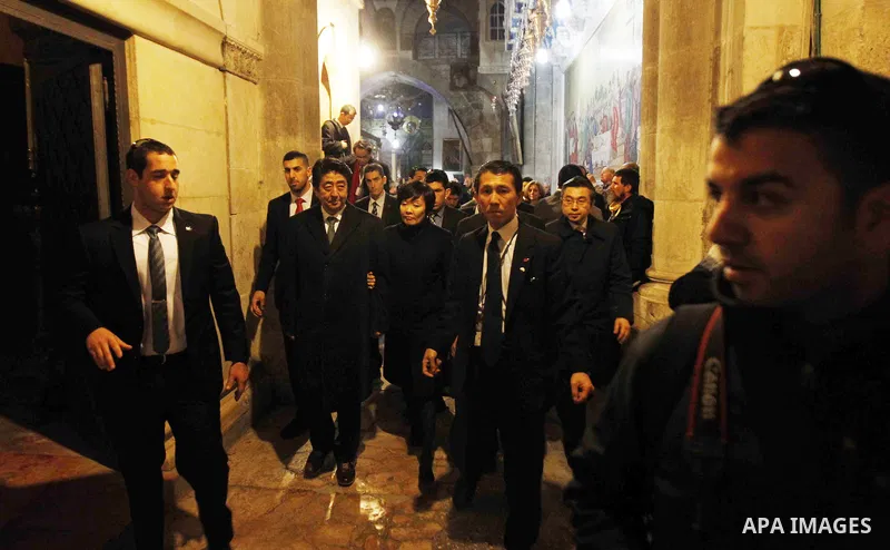 Japanese Prime Minister Shinzo Abe visits the Church of the Holy Sepulchre during the last day of his three-day visit to Israel and the Palestinian Territories, in the Old City of Jerusalem on January 19, 2015. Japan's P...
