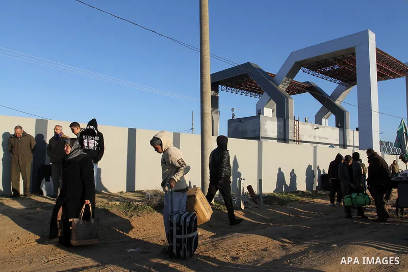 Palestinians, hoping to cross into Egypt , as they wait at the Rafah crossing between Egypt and the southern Gaza Strip January 20, 2015. Egyptian authorities opened Rafah crossing, Gaza's main window to the outside worl...