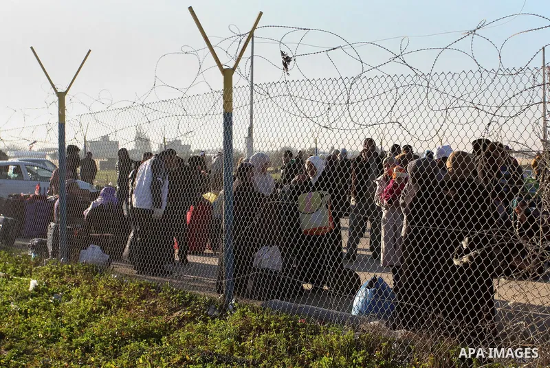 Palestinians, hoping to cross into Egypt , as they wait at the Rafah crossing between Egypt and the southern Gaza Strip January 20, 2015. Egyptian authorities opened Rafah crossing, Gaza's main window to the outside worl...