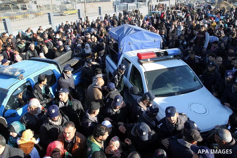 Palestinians, hoping to cross into Egypt , as they wait at the Rafah crossing between Egypt and the southern Gaza Strip January 20, 2015. Egyptian authorities opened Rafah crossing, Gaza's main window to the outside worl...