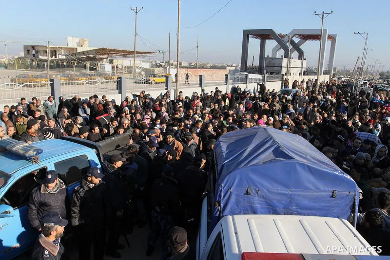 Palestinians, hoping to cross into Egypt , as they wait at the Rafah crossing between Egypt and the southern Gaza Strip January 20, 2015. Egyptian authorities opened Rafah crossing, Gaza's main window to the outside worl...