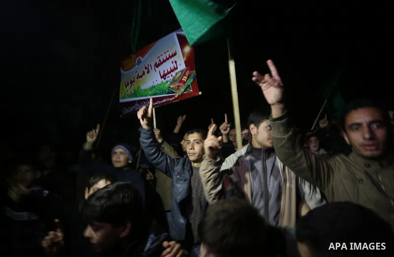 Palestinians take part in a protest against a cartoon of the Prophet Mohammed that was published by the French satirical magazine Charlie Hebdo in an edition issued a week after 12 people were killed by Islamist gunmen a...