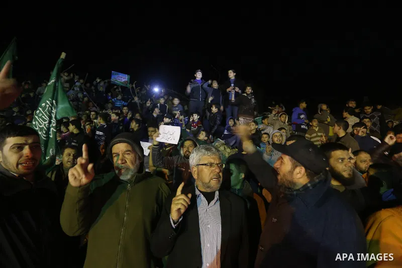 Palestinians take part in a protest against a cartoon of the Prophet Mohammed that was published by the French satirical magazine Charlie Hebdo in an edition issued a week after 12 people were killed by Islamist gunmen a...