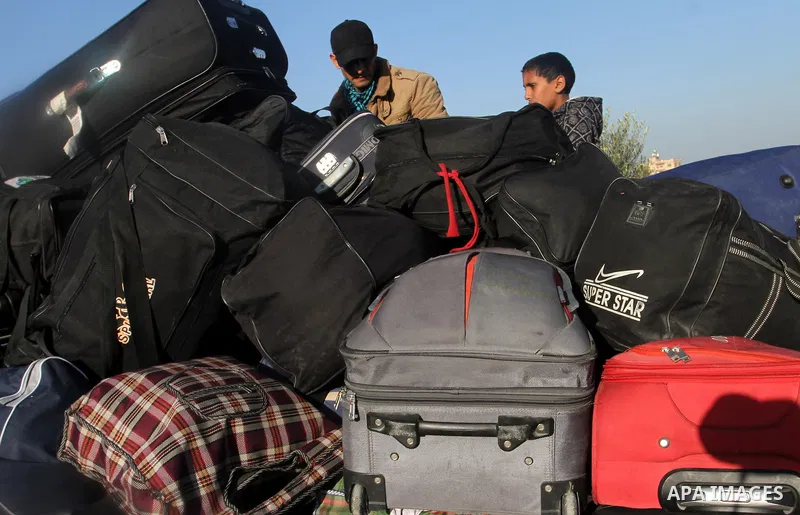 Palestinians, hoping to cross into Egypt, wait for a travel permit at the Rafah crossing between Egypt and the southern Gaza Strip January 22, 2015. Egyptian authorities opened the Rafah border crossing on Tuesday for th...